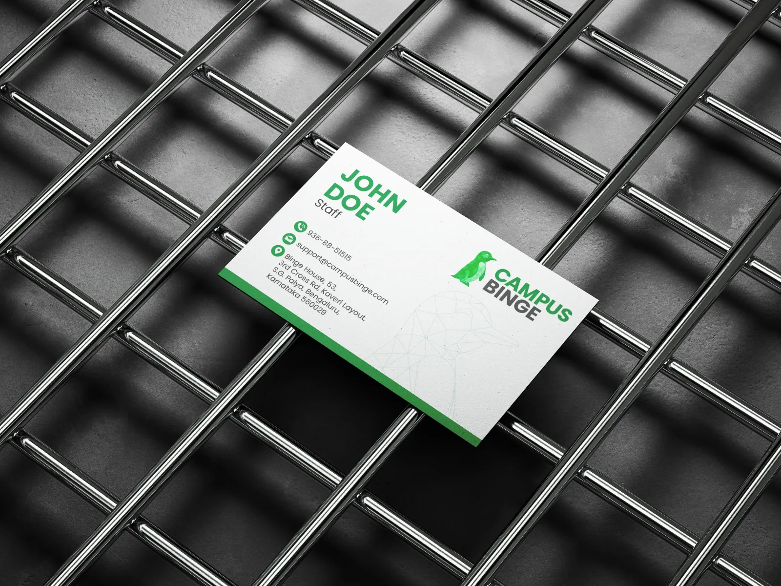 A Campus Binge business card on a metal grid
